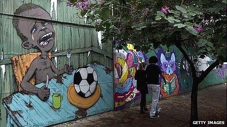 Graffiti painted by Brazilian street artist Paulo Ito on the entrance of a public schoolhouse in Sao Paulo