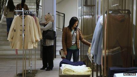 Women look at clothes inside a Zara store