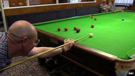 Conservative club members in Seaham playing and watching snooker