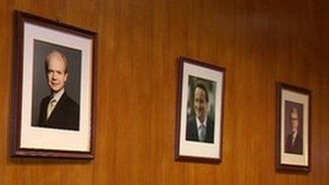 Pictures of Conservative party leaders on a wall