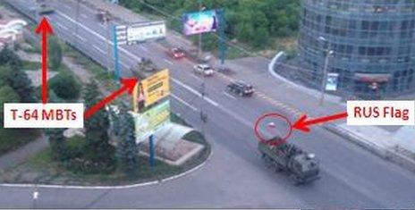 Alleged T-65 is shown in Makiiva, next to a lorry with a Russian flag