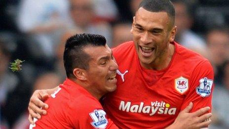 Gary Medel and Steven Caulker celebrate a Cardiff City goal