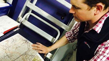 Capt Rupert Robinson studies a WW1 map