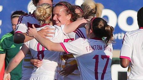 Kim Little celebrates with team-mates after scoring Scotland's first goal