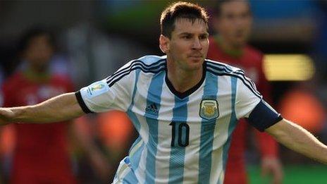 Lionel Messi celebrates scoring against Iran