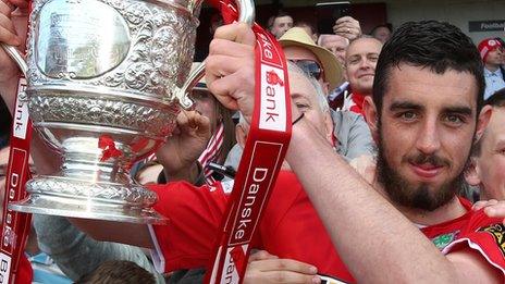 Cliftonville's Joe Gormley with the Irish Premiership trophy