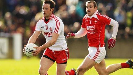 Tyrone forward Martin Penrose moves clear of Louth's Paddy Keenan