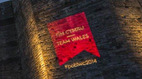 The red logo was projected on to castles around Wales