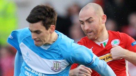 Ballymena United's Mark Surgenor in action against Barry Johnston of Cliftonville