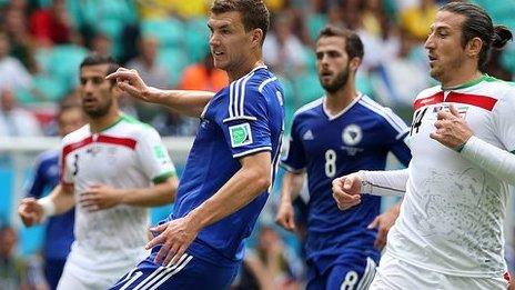 Edin Dzeko looks on as his shot makes it 1-0 to Bosnia-Hercegovina