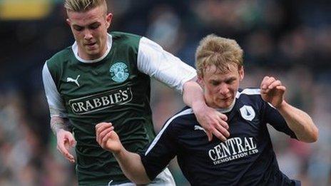 Stephen Kingsley of Falkirk battles with Daniel Handling of Hibernian