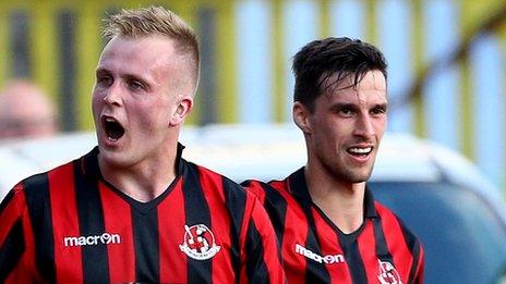 Goalscorer Jordan Owens is congratulated by Crusaders team-mate Declan Caddell