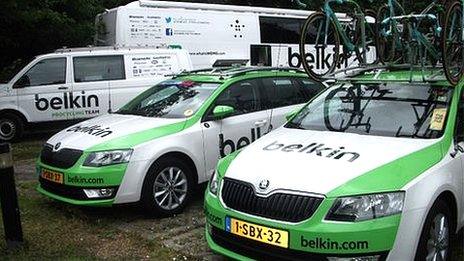 Two Belkin cars, one van, and the team coach