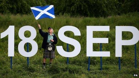 Ronnie Anderson from Edinburgh waves a Saltire flag