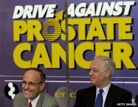 Rudy Giuliani and a fellow New York politician at a mobile medical vehicle offering free prostate cancer screenings for men