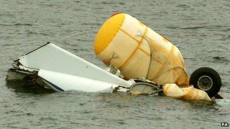 Helicopter wreckage being salvaged