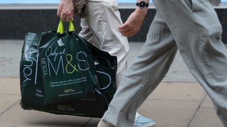 Person carrying M&S bag