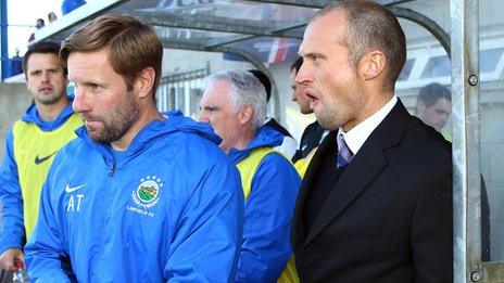 Linfield manager Warren Feeney in the dug-out at Mourneview Park