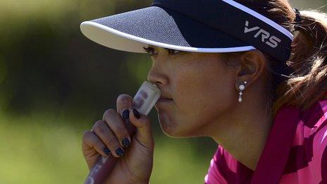 Michelle Wie looks pensive on her way missing the cut in the British Open