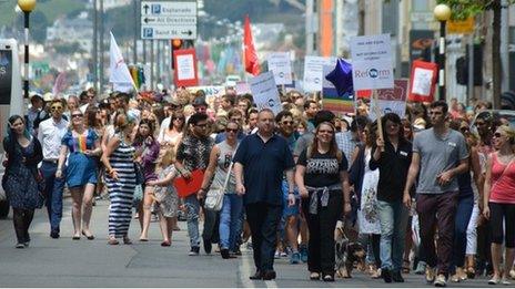 Gay rights protestors march to Liberty Square