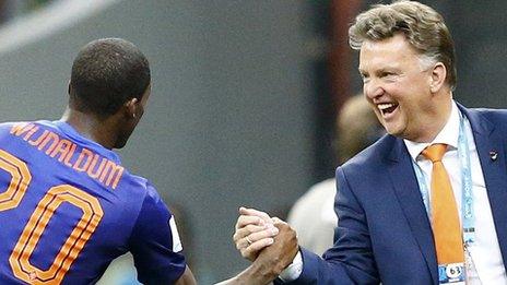 Georginio Wijnaldum celebrates scoring the Netherlands' third against Brazil with coach Louis van Gaal