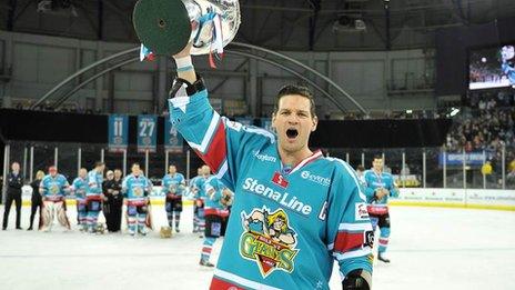 Giants captain Adam Keefe celebrates with the Elite League trophy in a fourth title success for Belfast