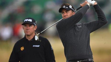 Ian Poulter pictured during practice at Hoylake as Lee Westwood looks on