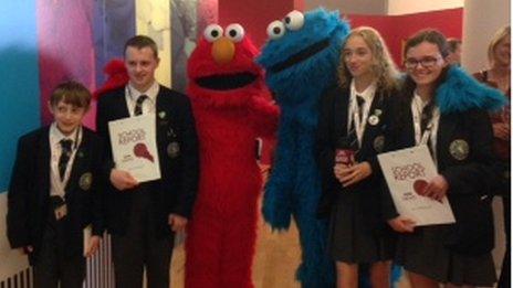 Elmo and the Cookie Monster from Sesame Street stopped to chat to the School Reporters