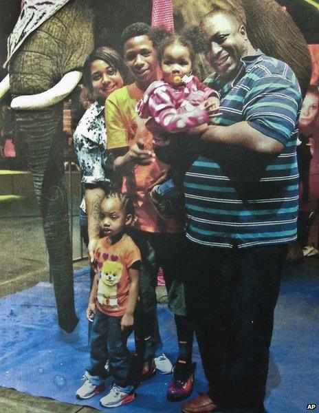 An undated photo of Eric Garner (right) with his family