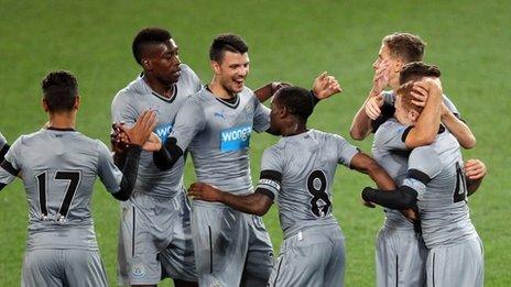 Newcastle players celebrating a goal