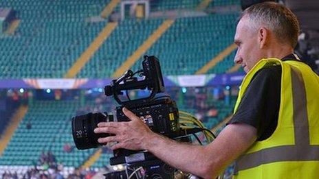 A BBC R&D engineer sets up one of the UHD cameras at a games venue