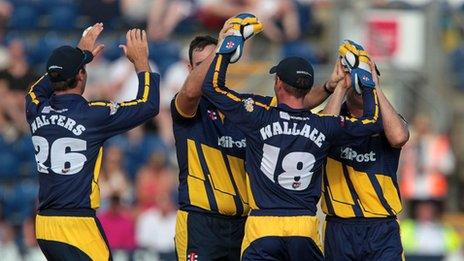 Glamorgan celebrate taking a wicket against Gloucestershire
