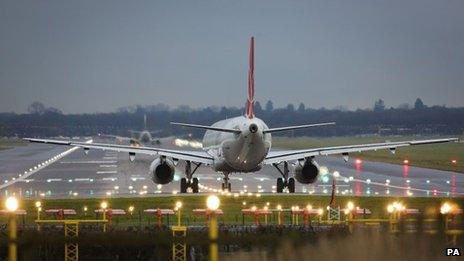 A passenger jet on the runway at Gatwick Airport