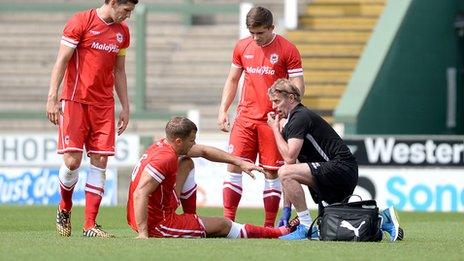 Cardiff City's Ben Turner receives treatment