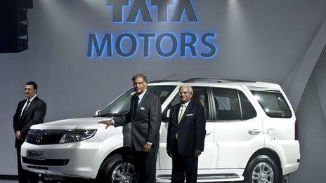 Former Tata chairman Ratan Tata, centre, and Cyrus Mistry, left, with the Tata Safari Storme car