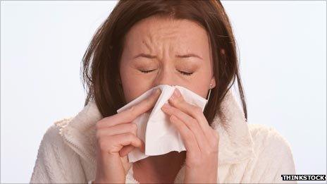 Woman sneezing