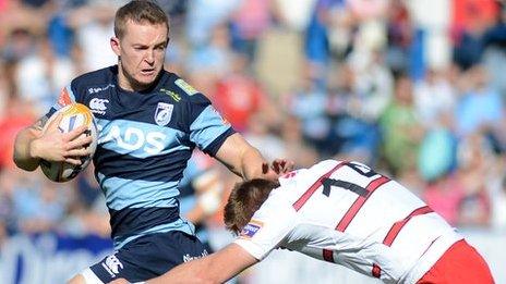 Owen Williams is tackled by Dougie Fife of Edinburgh