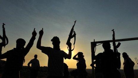 Members of Jihadist group Hamza Abdualmuttalib train near Aleppo on 19 July 2012.