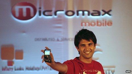 Model holding up micromax phone