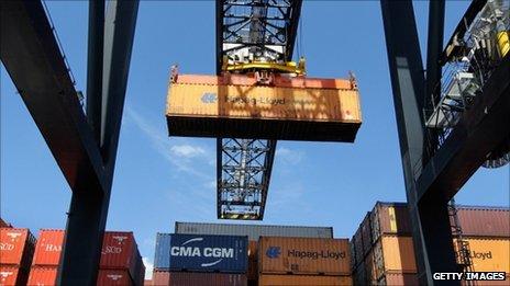 Cargo containers being moved at a port