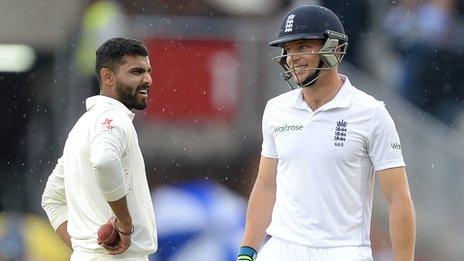 India's Ravindra Jadeja and England's Jos Buttler in the rain