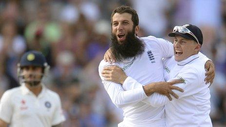 England's Moeen Ali and Joe Root celebrate a wicket