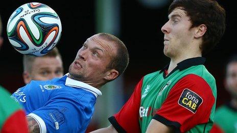 Warren Feeney of Linfield on the ball against Glentoran's Willie Garrett