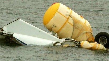 Helicopter wreckage being salvaged