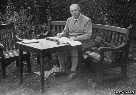 Portrait of Sir Arthur Conan Doyle sitting at a table in his garden, Bignell Wood, New Forest, 1927