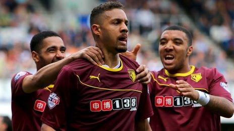 Mathias Ranegie (centre) celebrates with Troy Deeney