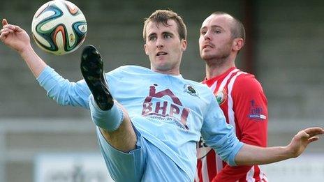 Stephen Curry and Stephen Hughes in action at Drumahoe