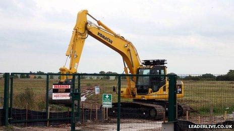 A digger on the proposed Wrexham prison site