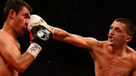 Lee Selby lands a jab on Romulo Koasicha