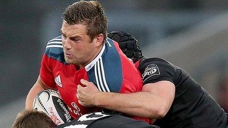 Munster try-scorer CJ Stander is tackled by Greig Tonks and Fraser McKenzie